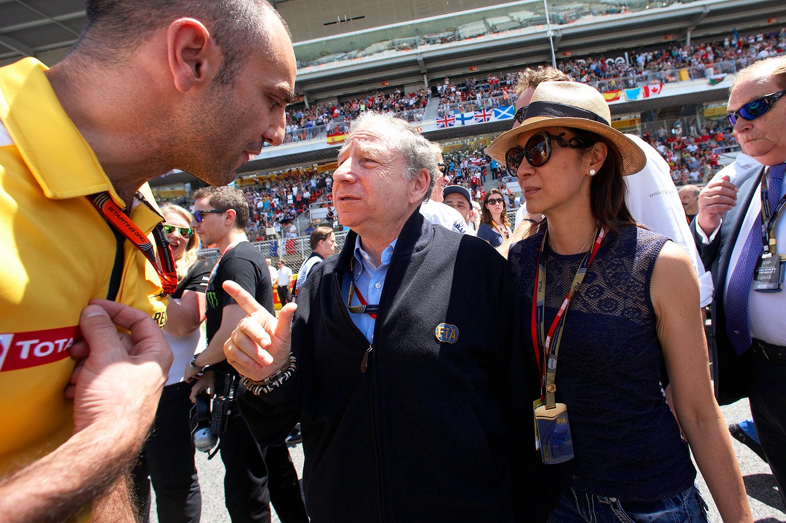 FIA president Jean Todt (at the right his wife Michelle) talkes to a Renault engineer on the grid, Spanish Grand Prix, Barcelona, 2015