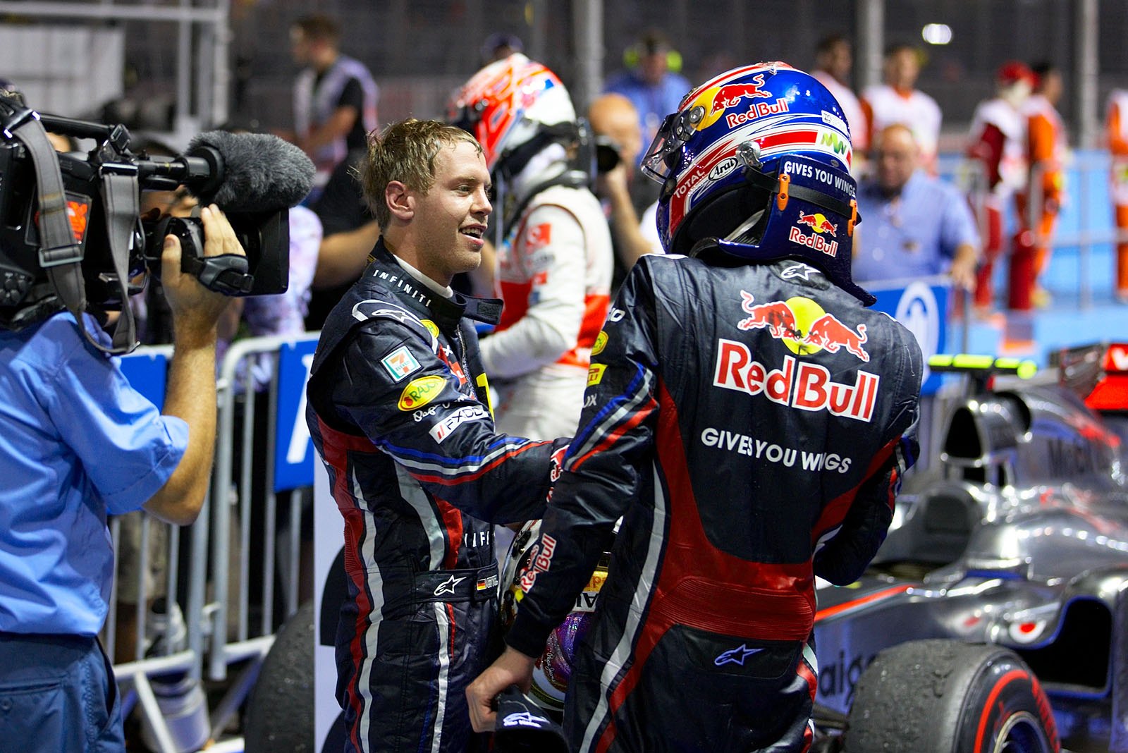 Race winner Sebastian Vettel, Red Bull Racing, receives congratulations from his team mate Mark Webber after the race in parc ferme