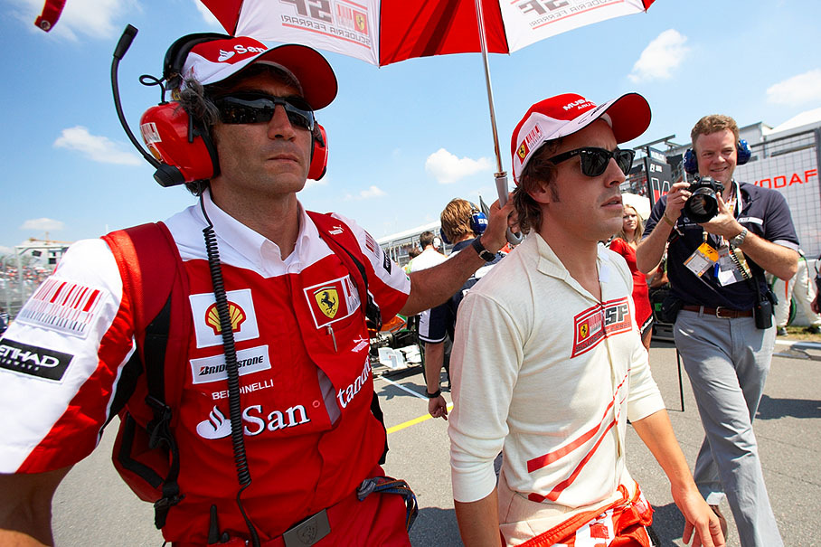 Fernando Alonso, Ferrari, walks to fourth grid position