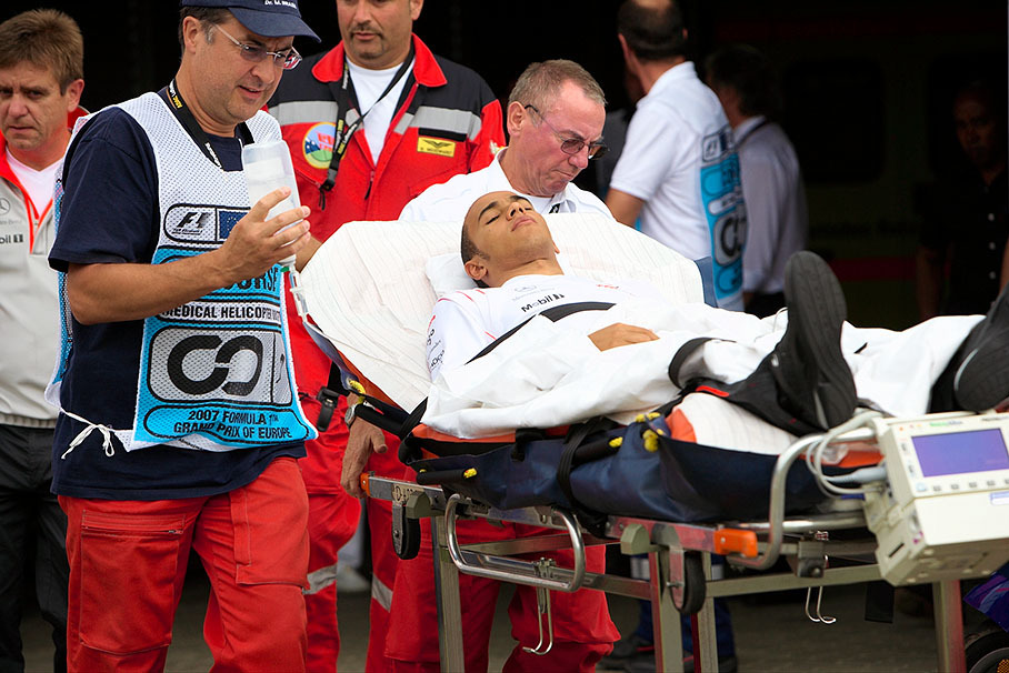 Lewis Hamilton being taken care of after his massive practice crash.