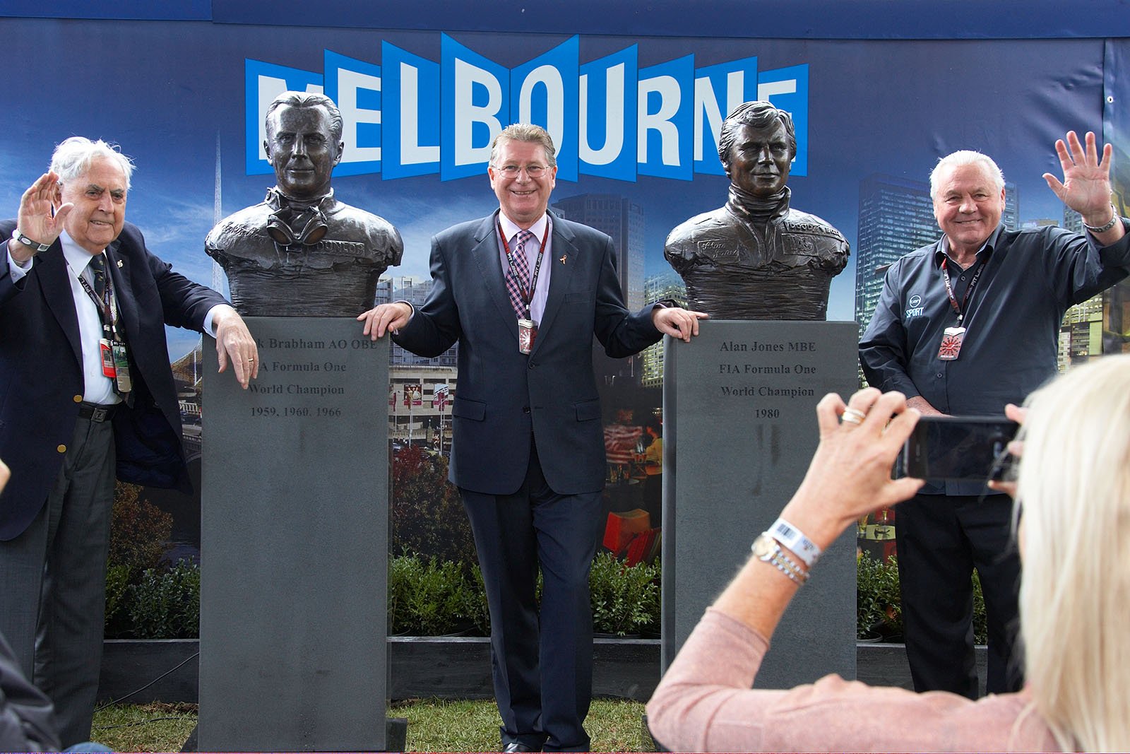 Sir Jack Brabham (AUS) and fellow World Champion Alan Jones (AUS) with the statues unveiled in their honour