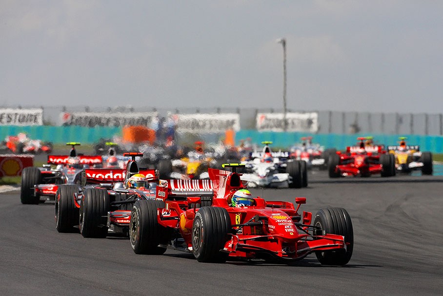 Massa leads the field into turn 2