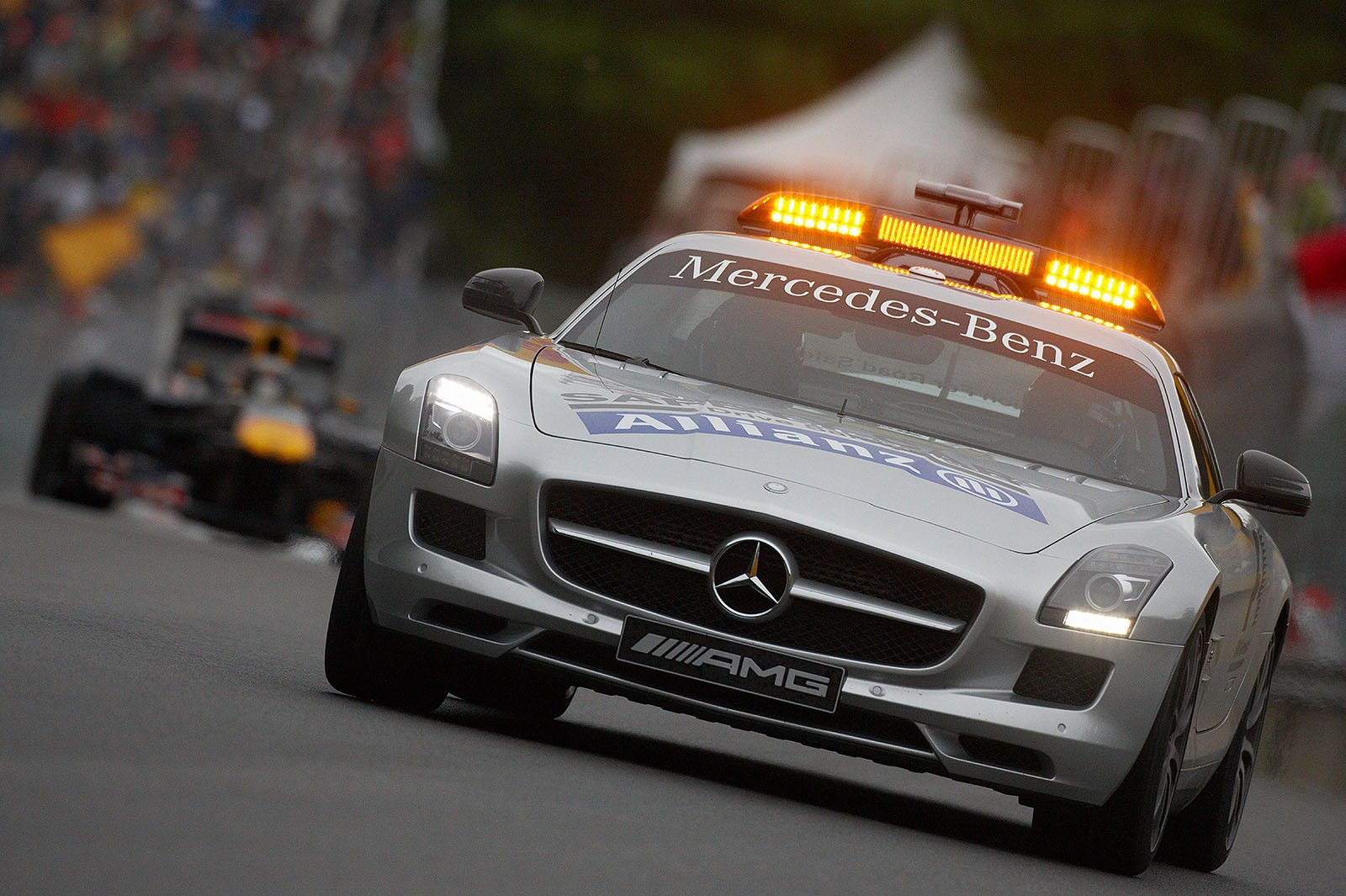 The safety car again in front of Vettel, Hamilton's crashed McLaren blockes the track