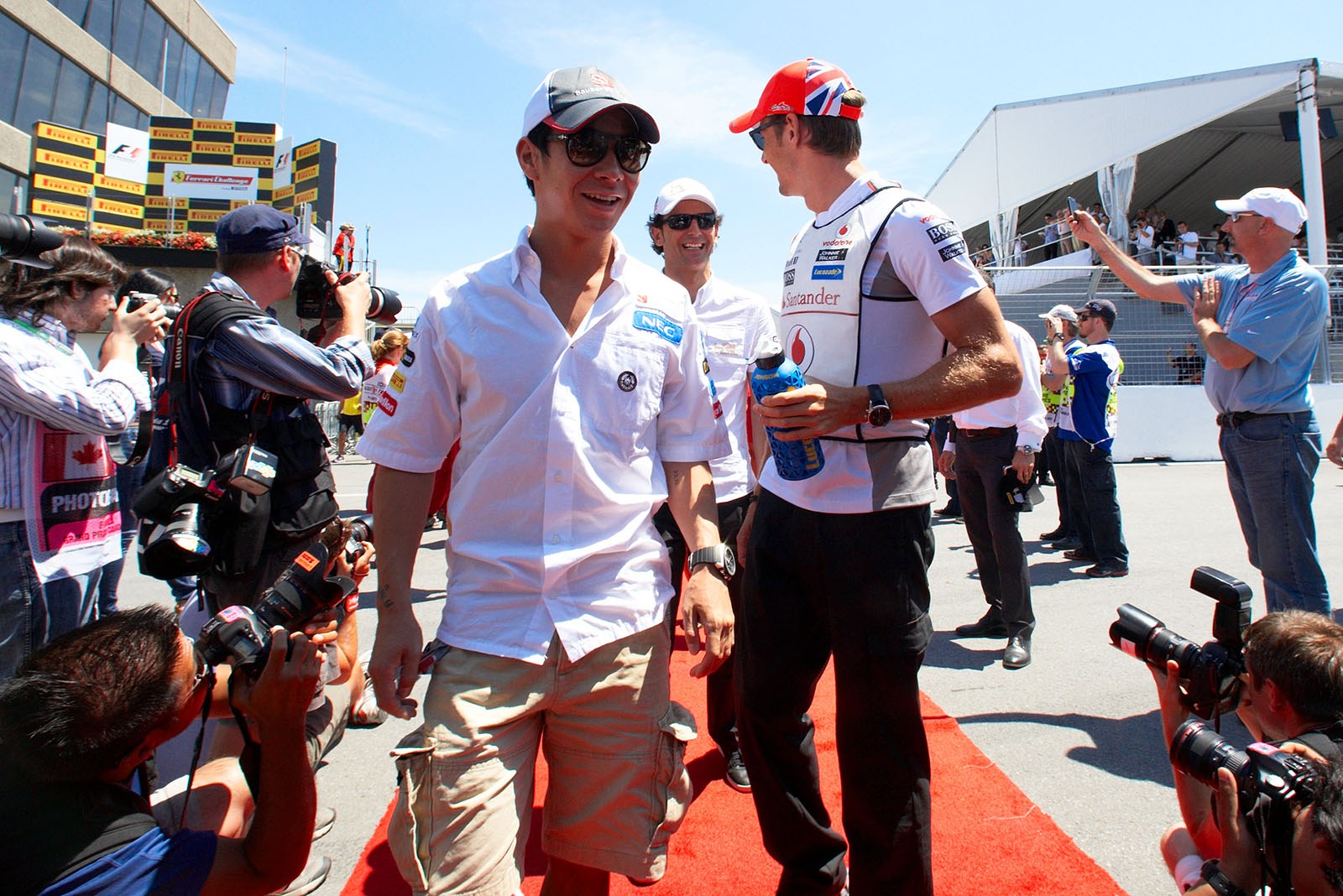 Kamui Kobayashi, Sauber F1 Team, walks to the drivers parade
