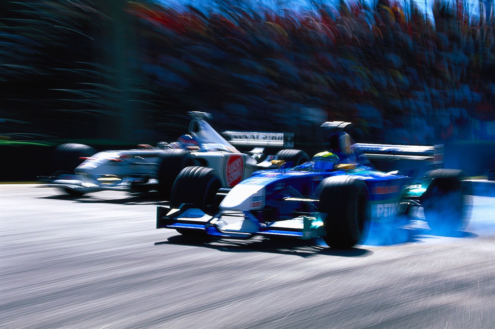Battle for points at the first chicane: Brazilian Felipe Massa, Sauber-Petronas, passes BAR driver Jacques Villeneuve. Brazilian Grand Prix, Sao Paulo, 2002