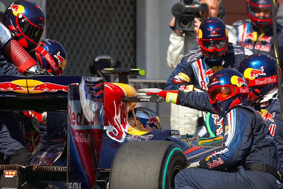 Sebastian Vettel ends his pit stop at Red Bull pits