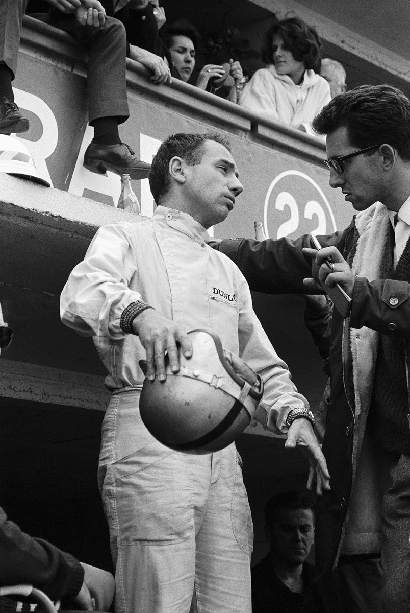 Ferrari sporting director and chief designer Mauro Forghieri talks with the luckless Willy Mairesse in Ferrari pits
