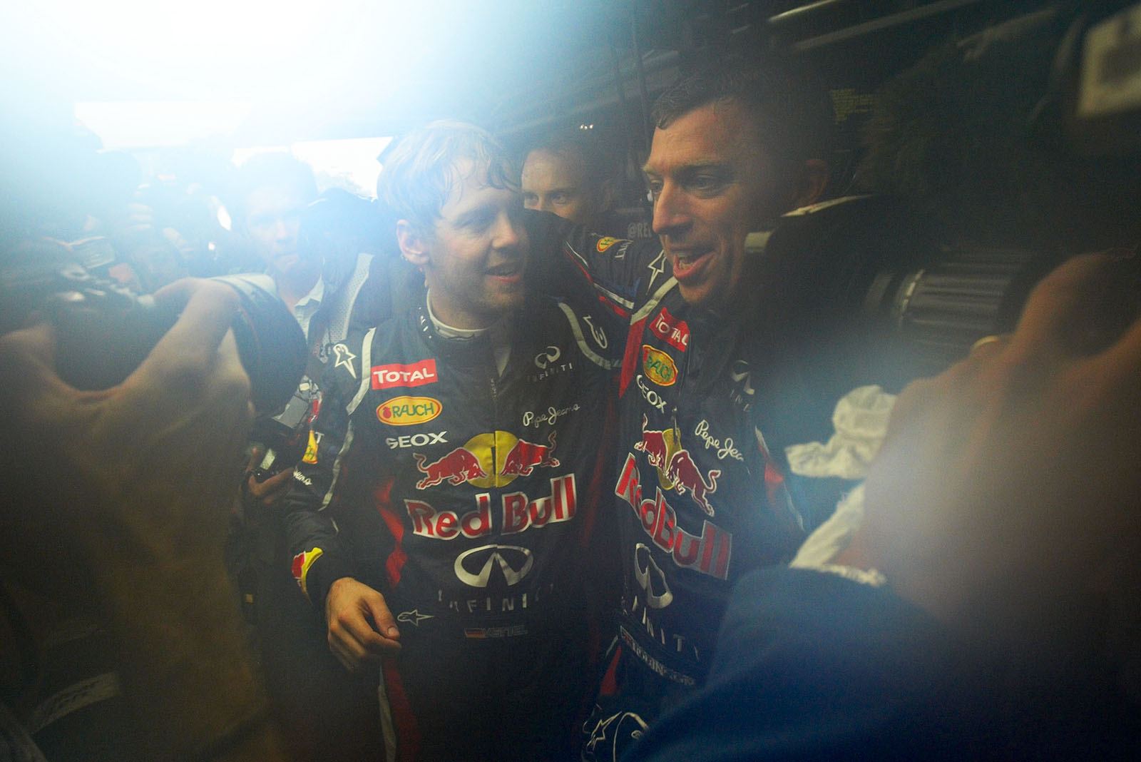 New triple Formula 1 World Champion Sebastian Vettel celebrates with his team in Red Bull Racing pits