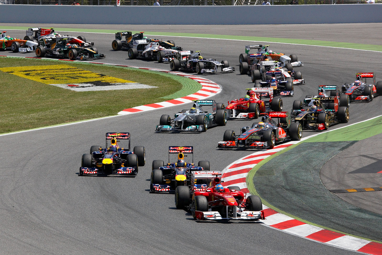Fernando Alonso up in front after the first corner.