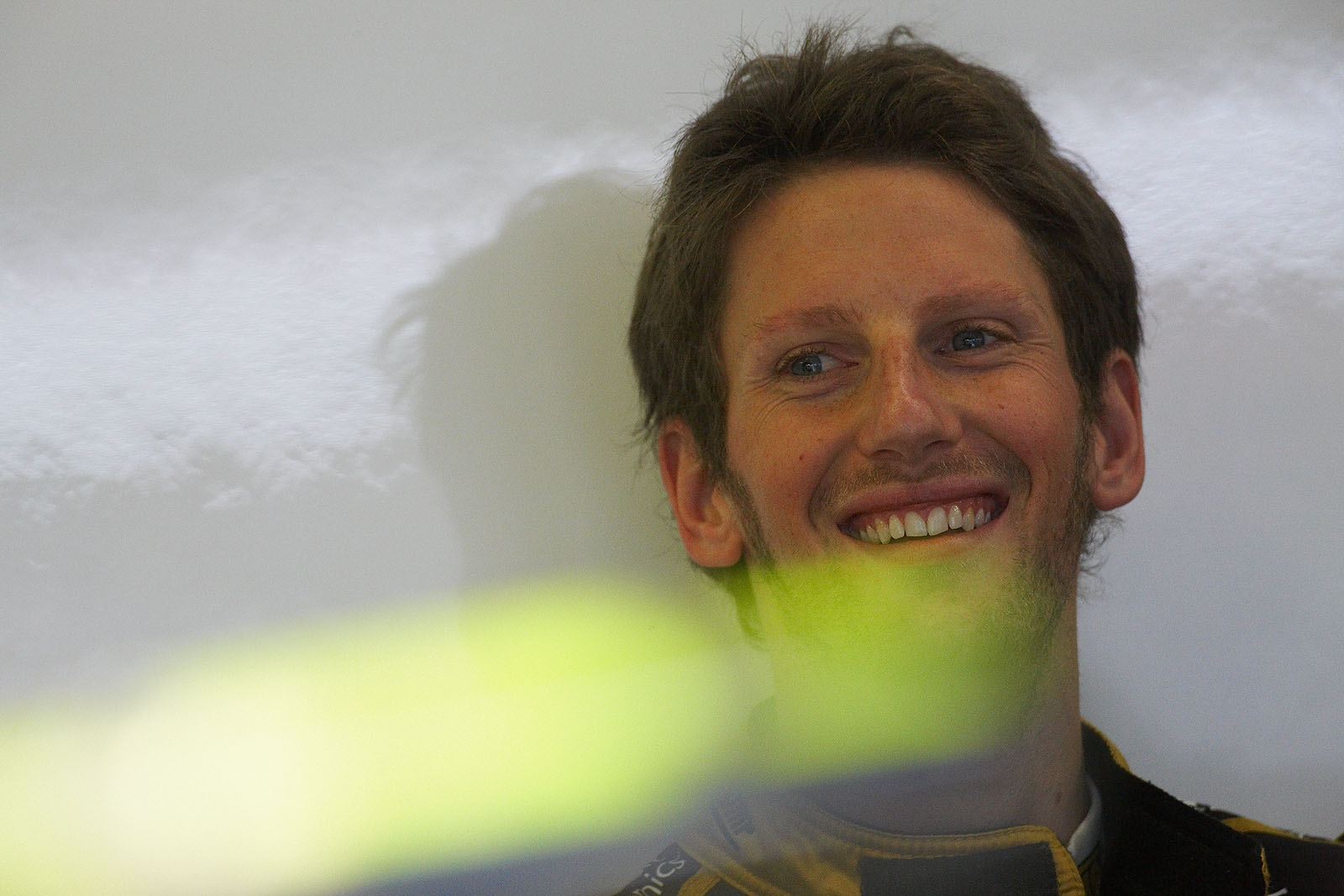 Romain Grosjean enjoys his view into Lotus pits
