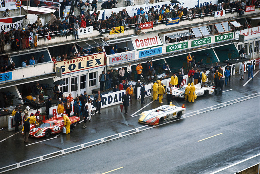 The third placed Porsche 908/02 LH 005 of Rudi Lins (A) and Helmut Marko (A) in parking position besides pits whilst the winning Porsche 917K 023 of Richard Attwood (GB) and Hans Herrmann (D) is being serviced in front and the just retiring Porsche 917L 042 of Vic Elford (GB) and Kurt Ahrens, Jr. (D) with unhappy looking mechanics around it behind them