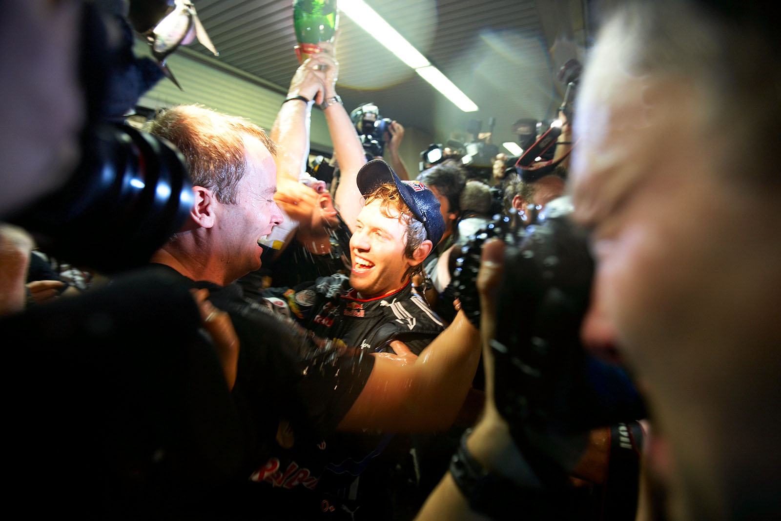 Sebastian Vettel celebrates with the Red Bull team