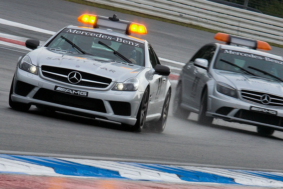 The safety car and the medical car clear the track together