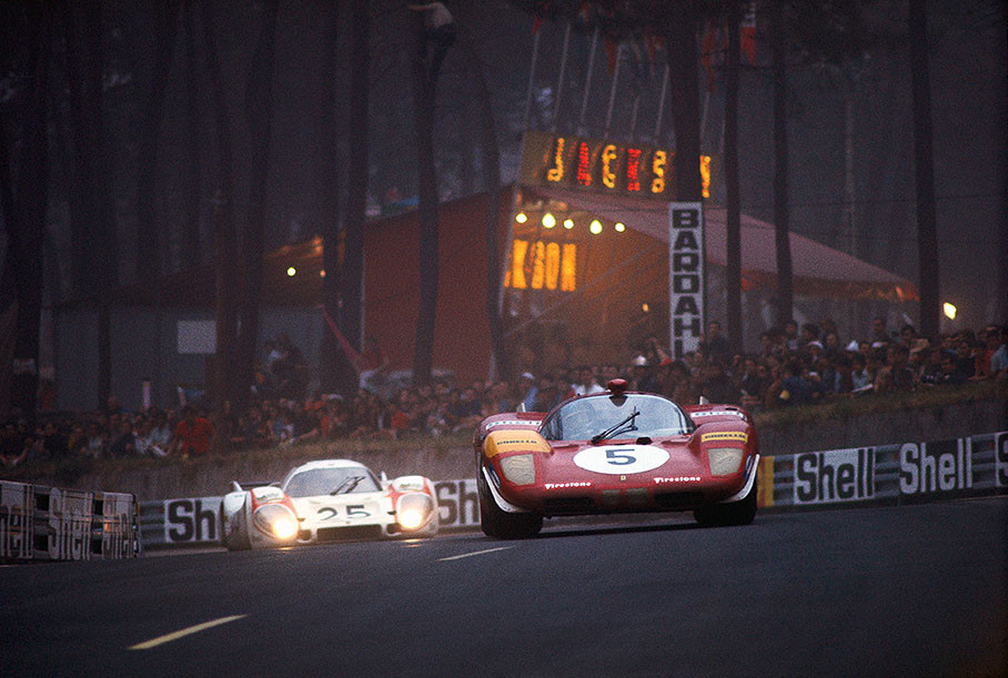 Jacky Ickx at the wheel of the Ickx (B)/Schetty (CH) Ferrari 512 S #1038 leads the Porsche 917L 042 of Vic Elford (GB) and Kurt Ahrens, Jr. (D)