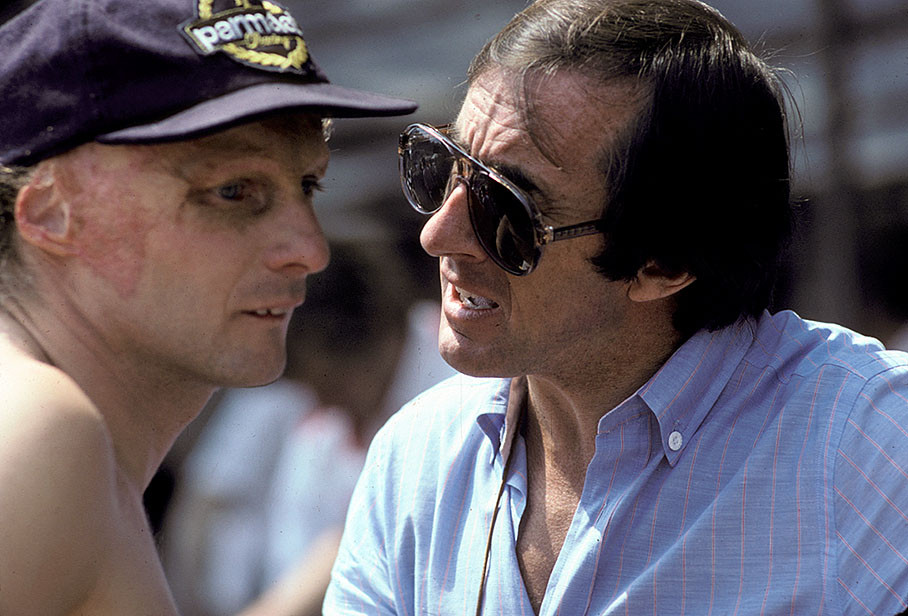Jackie Stewart and Niki Lauda chat in Monaco's paddock