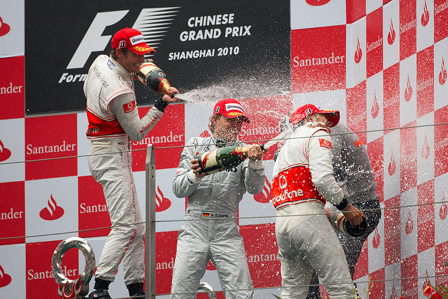 Champagne shower for second placed Hamilton