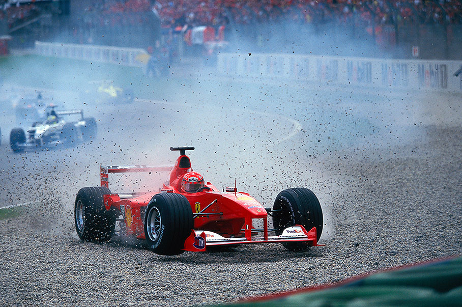 At the start, Michael Schumacher in his Ferrari was kicked off by Fisichella's Benetton