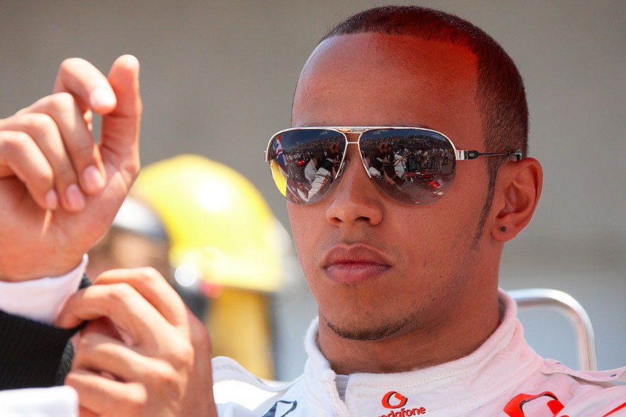 A cool Hamilton watches the arrangements for the race at his pole position