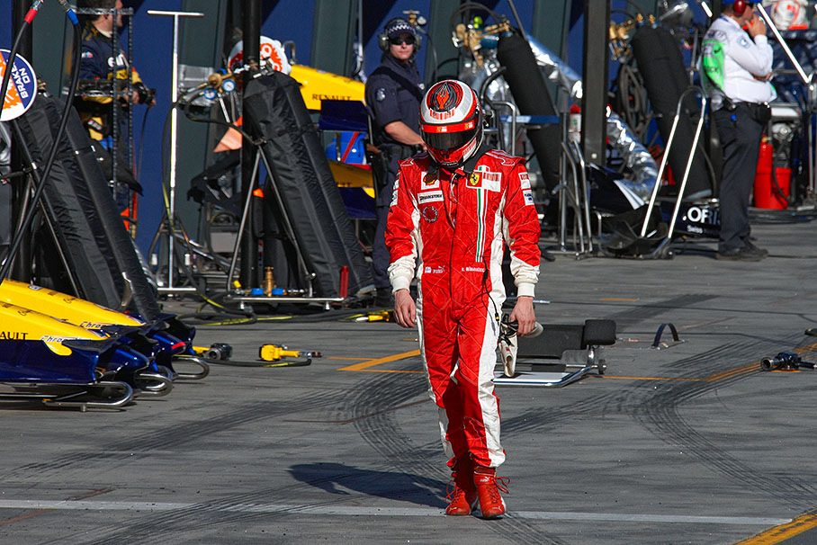 Five laps before race finish Raikkonen walks back trough pitlane after retiring with failing engine in lap 53