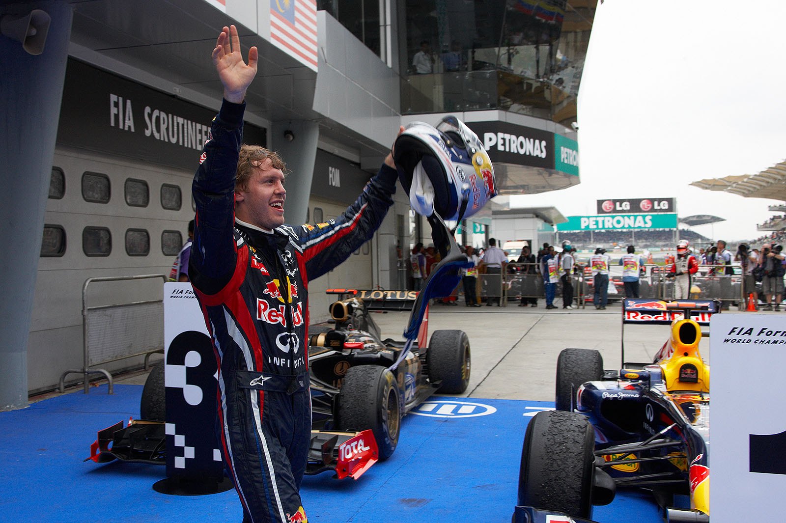 Red Bull's World Champion Sebastian Vettel celebrates in parc ferme after the Malaysian GP
