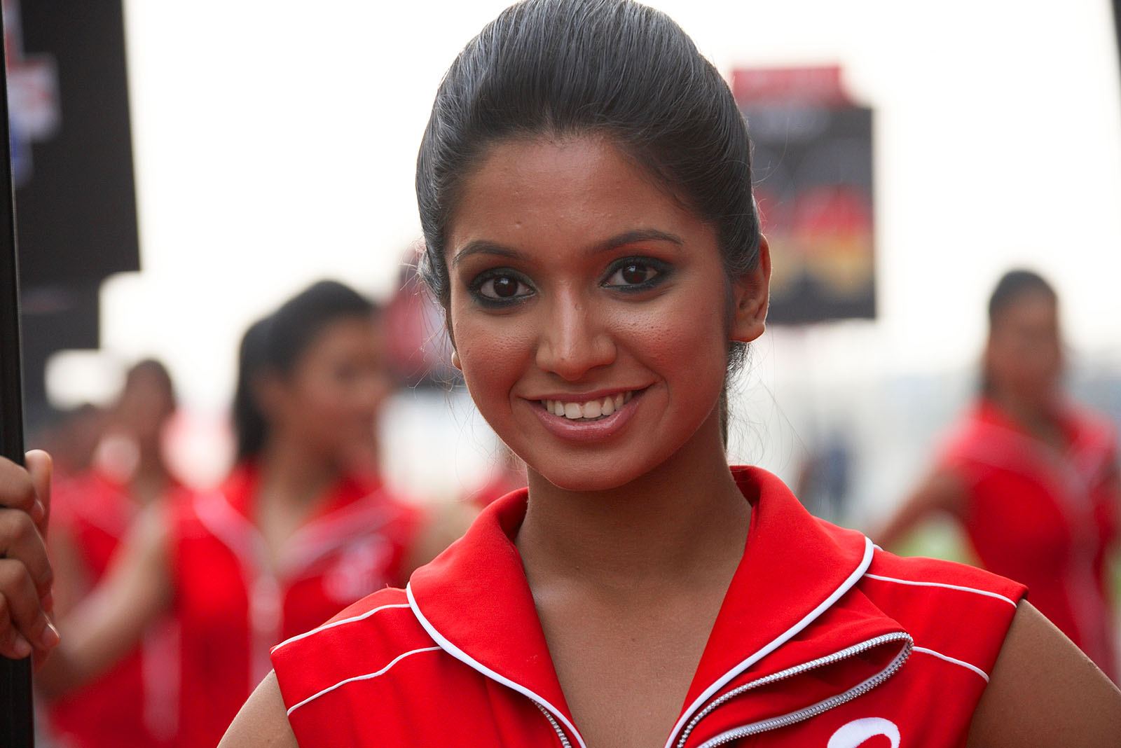 A friendly looking Indian grid girl
