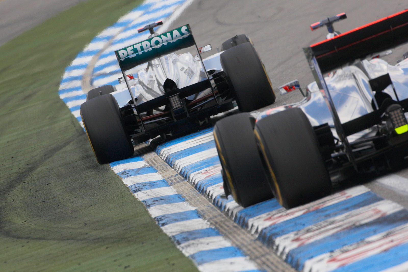 Michael Schumacher, Mercedes GP, with pressure from behind