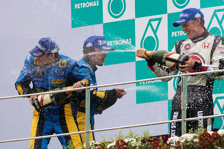 Champagne shower for Fisichella, Alonso and Button