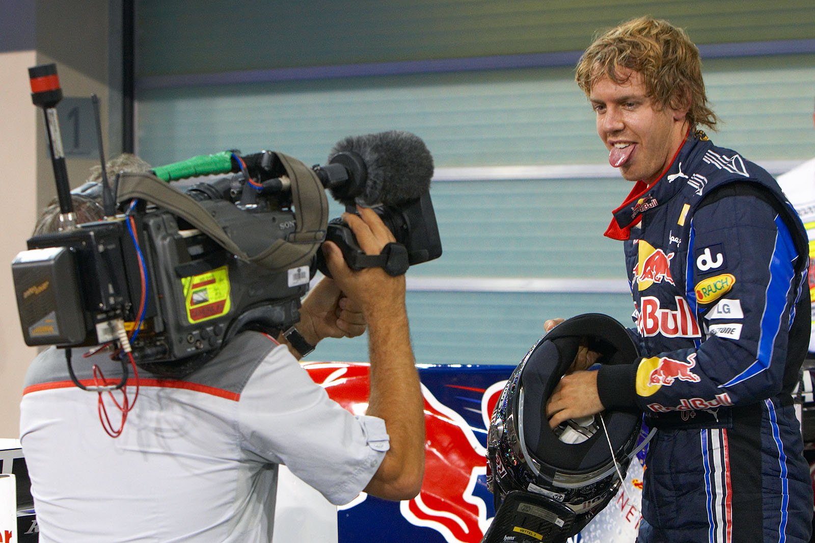 Sebastian Vettel jokes around in parc ferme after qualifying first