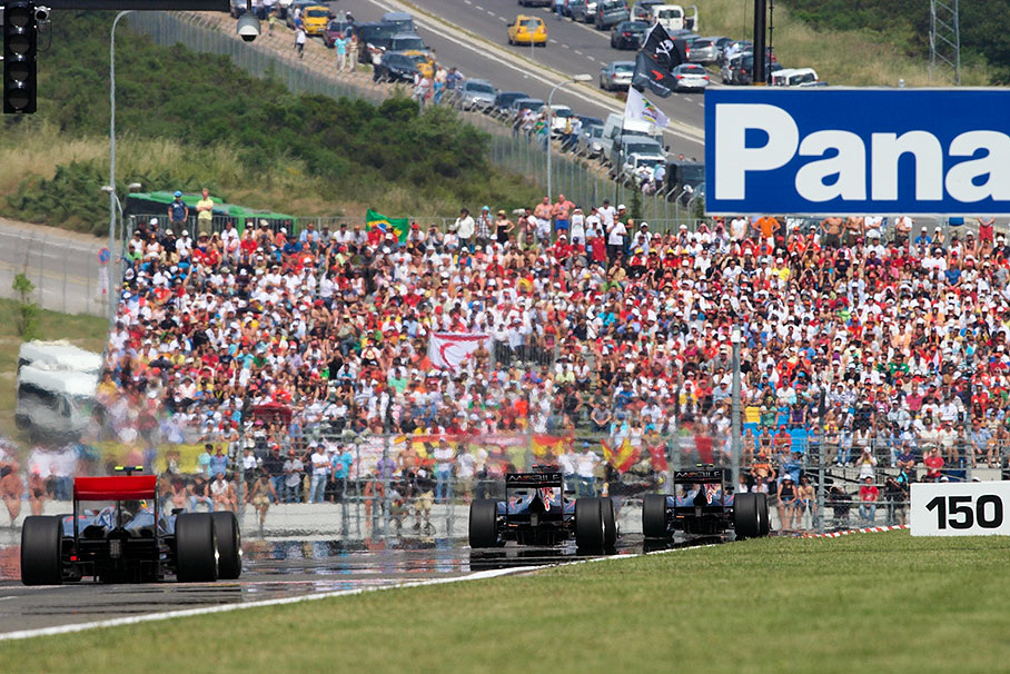 The group of the leading three, the two Red Bull-Renaults with Webber in front of Hamilton