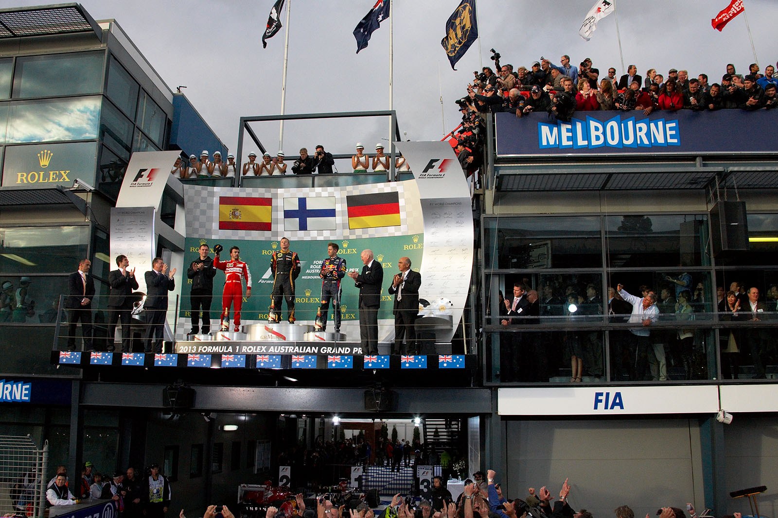 Podium ceremony with Renault's race engineer Alan Permane, second placed Fernando Alonso of Ferrari, race winner Kimi Raikkonen of Lotus and Red Bull's third placed Sebastian Vettel