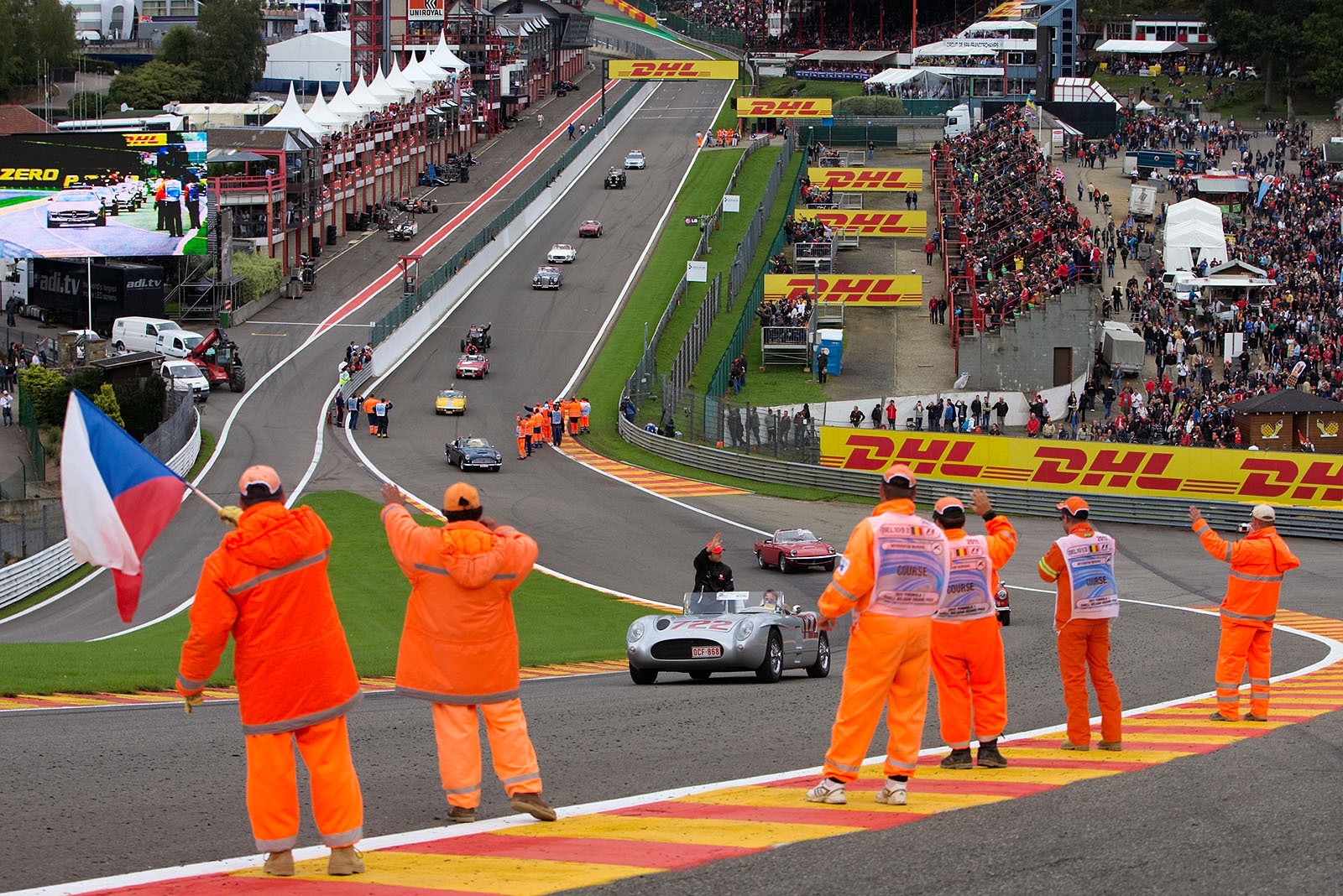 The drivers parade, this time as a historic car corso, defiles through Eau Rouge