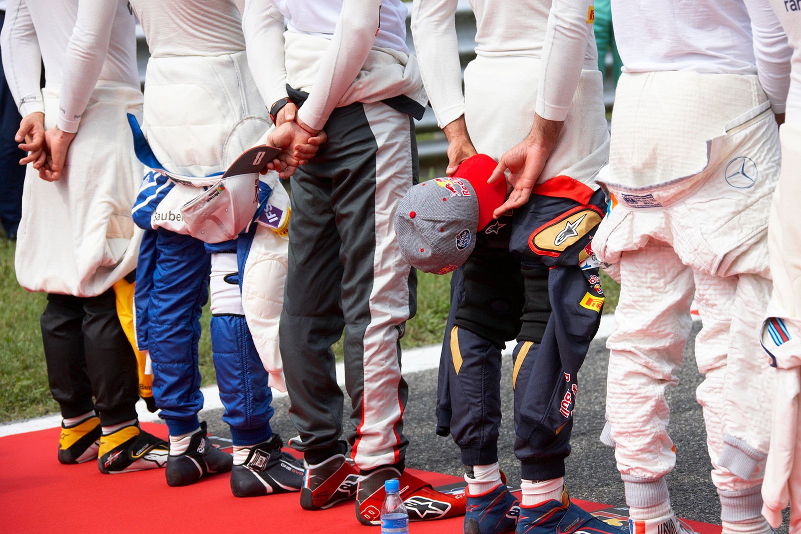 Devot drivers as the grid observe the national anthem, Monza, Italian Grand Prix, 2016