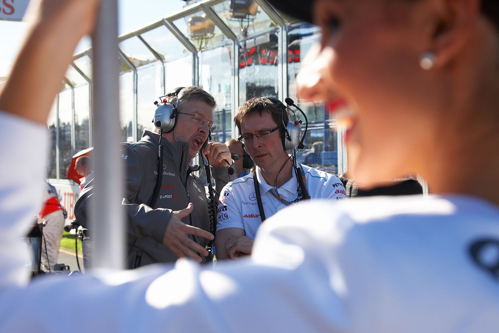 Mercedes Grand Prix team boss Ross Brawn talks to an engineer on the grid
