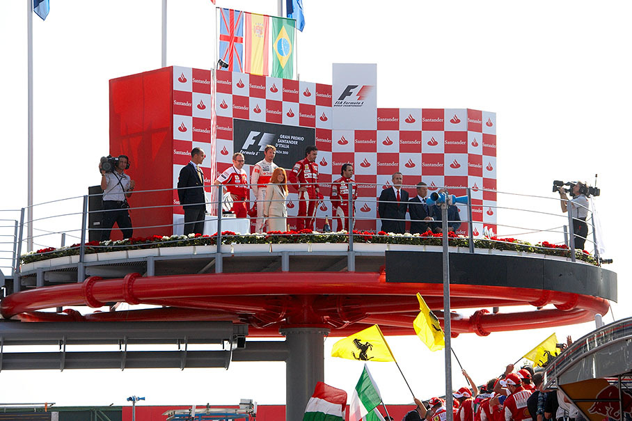 Podium group photo after the Italian GP 2010: Ferrari team principal Stefano Domenicali, Second placed Jenson Button of McLaren, race winner Fernando Alonso and third placed Felipe Massa