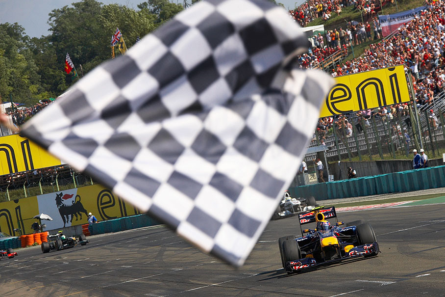Mark Webber, Red Bull Racing, takes the chequered flag and wins the 2010 Hungarian GP, now leading the Driver's World Championship after round 12 with 161 points