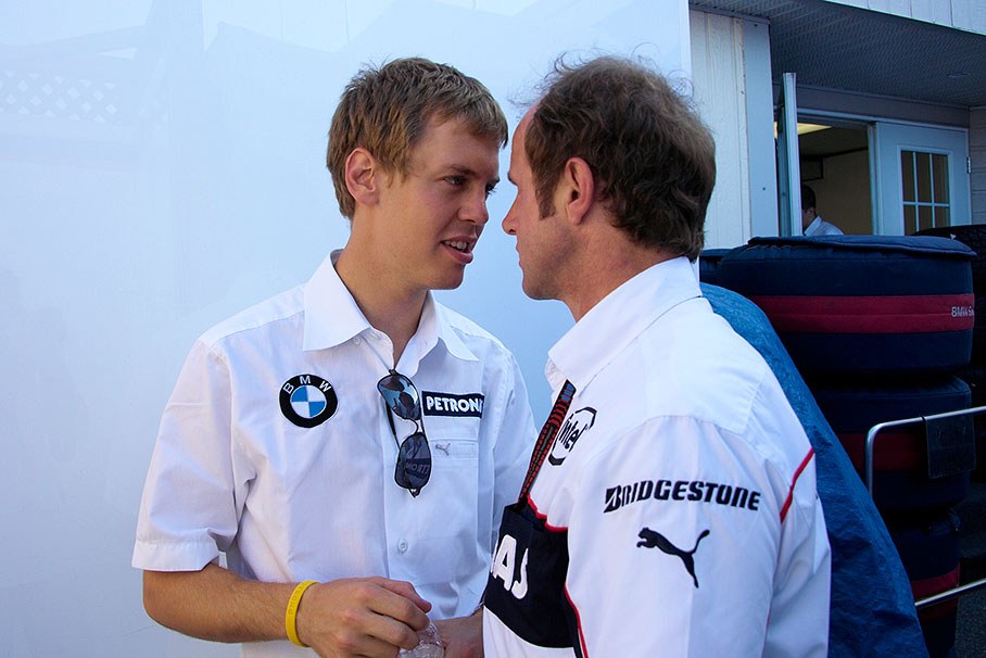 BMW test driver Sebastian Vettel and Sauber physio Jo Leberer caught during an intimate discussion...