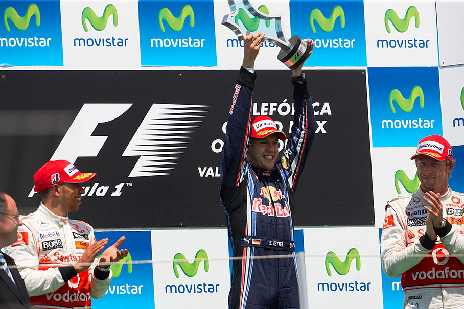 Race winner Sebastian Vettel raises his trophy