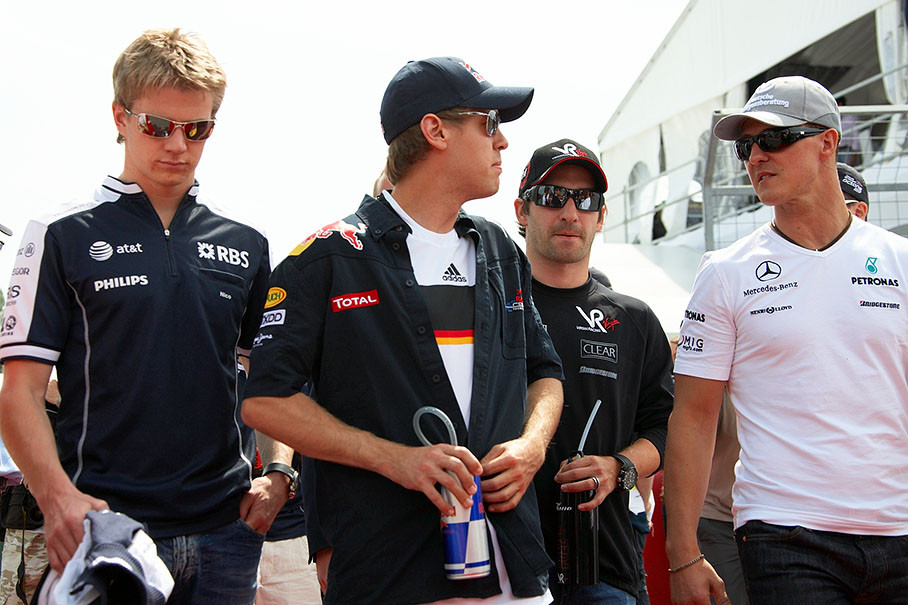 Four German drivers walk to drivers parade - Nico Hulkenberg, Seb Vettel, Timo Glock and Michael Schumacher