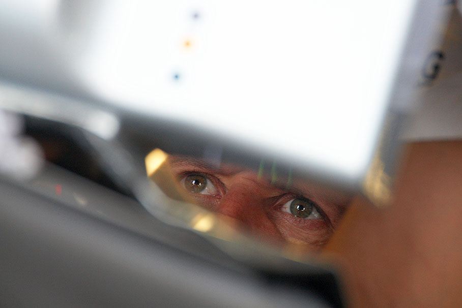 Michael Schumacher attentively watches the lap times