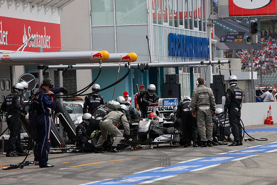 Michael Schumacher stops at Mercedes GP pits
