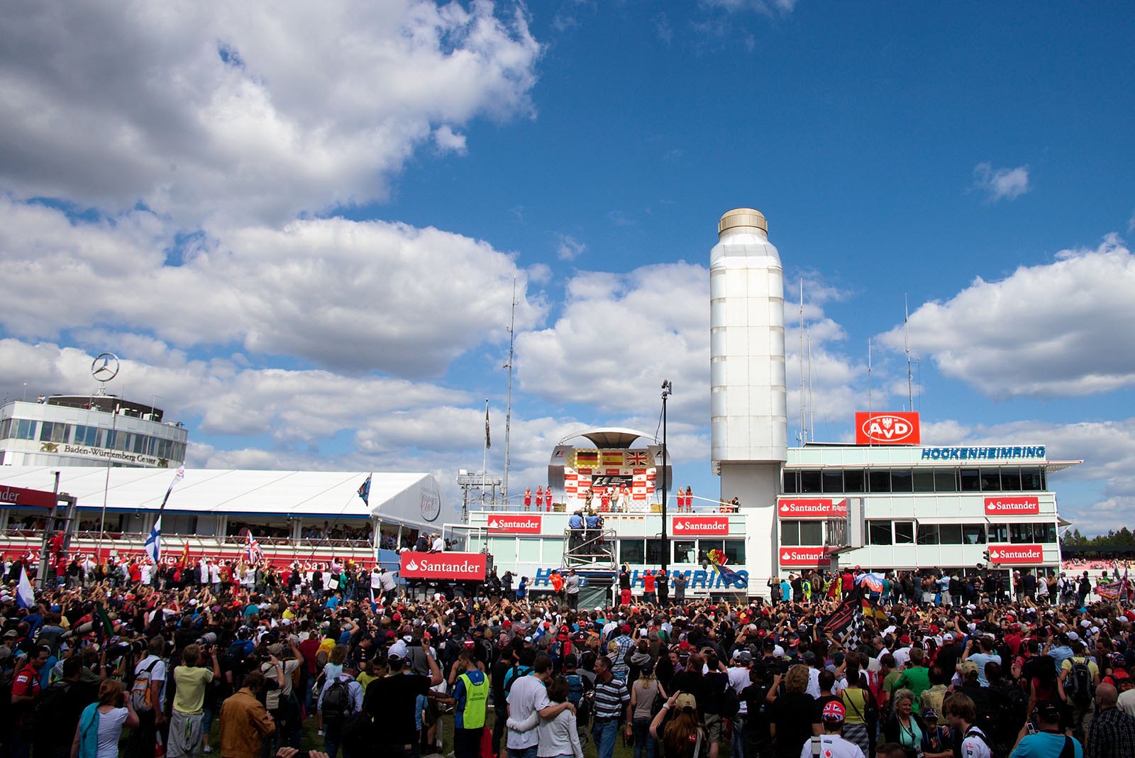 Race fans invade the Hockenheim track during the podium ceremony after therace