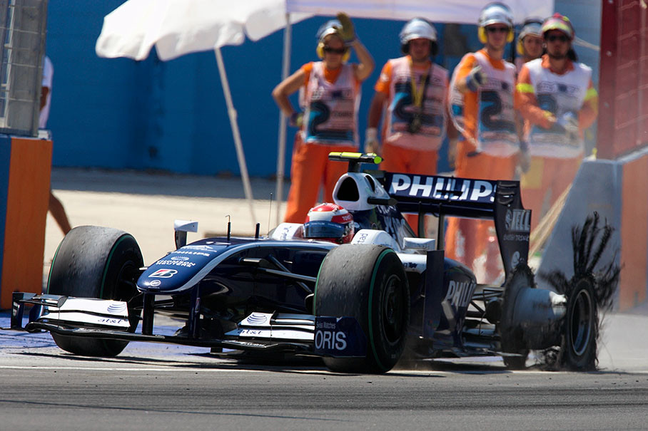 A tyre puncture forces Nakajima to drive slowly back to pits