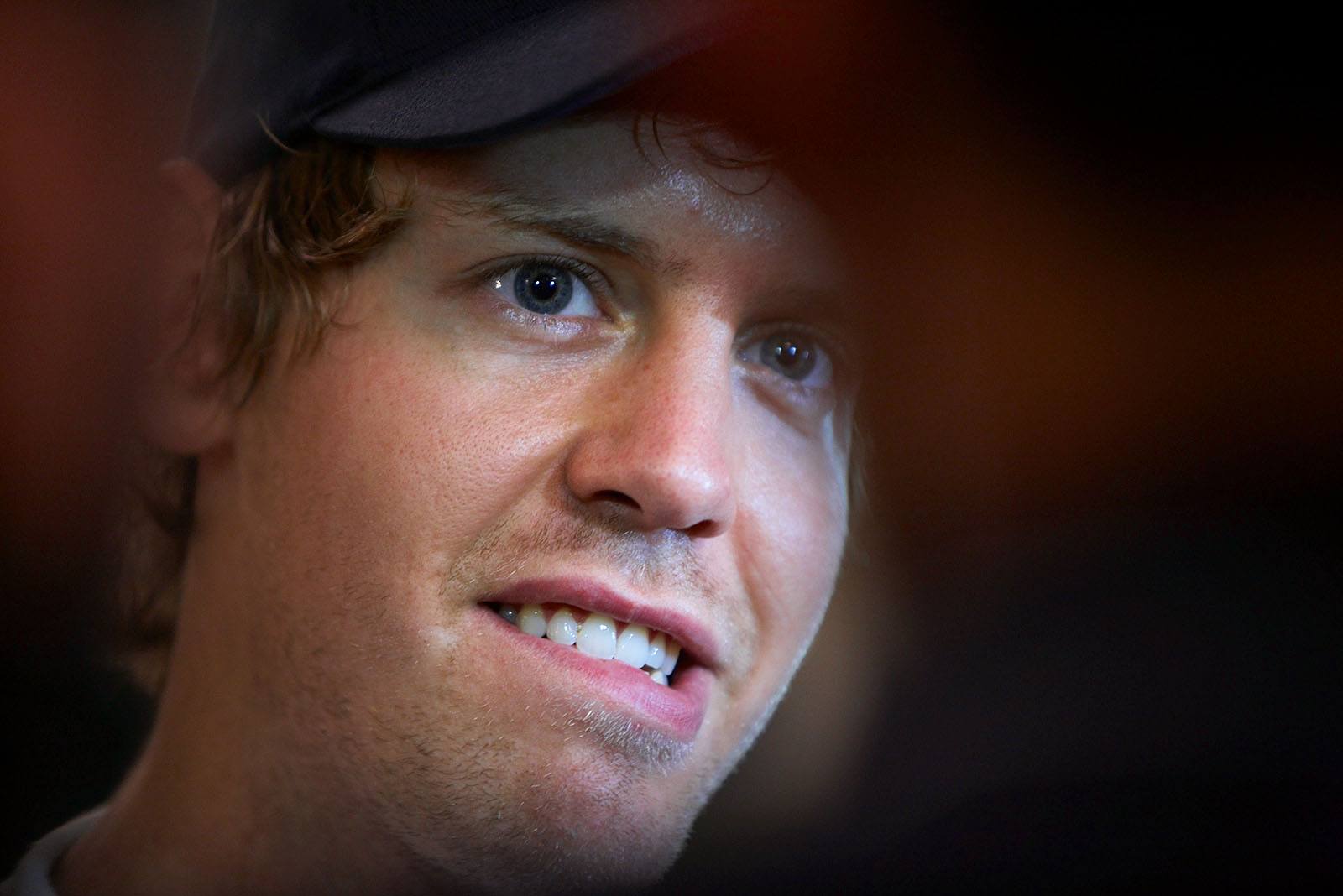 Red Bull's Sebastian Vettel gives an interview after qualifying first