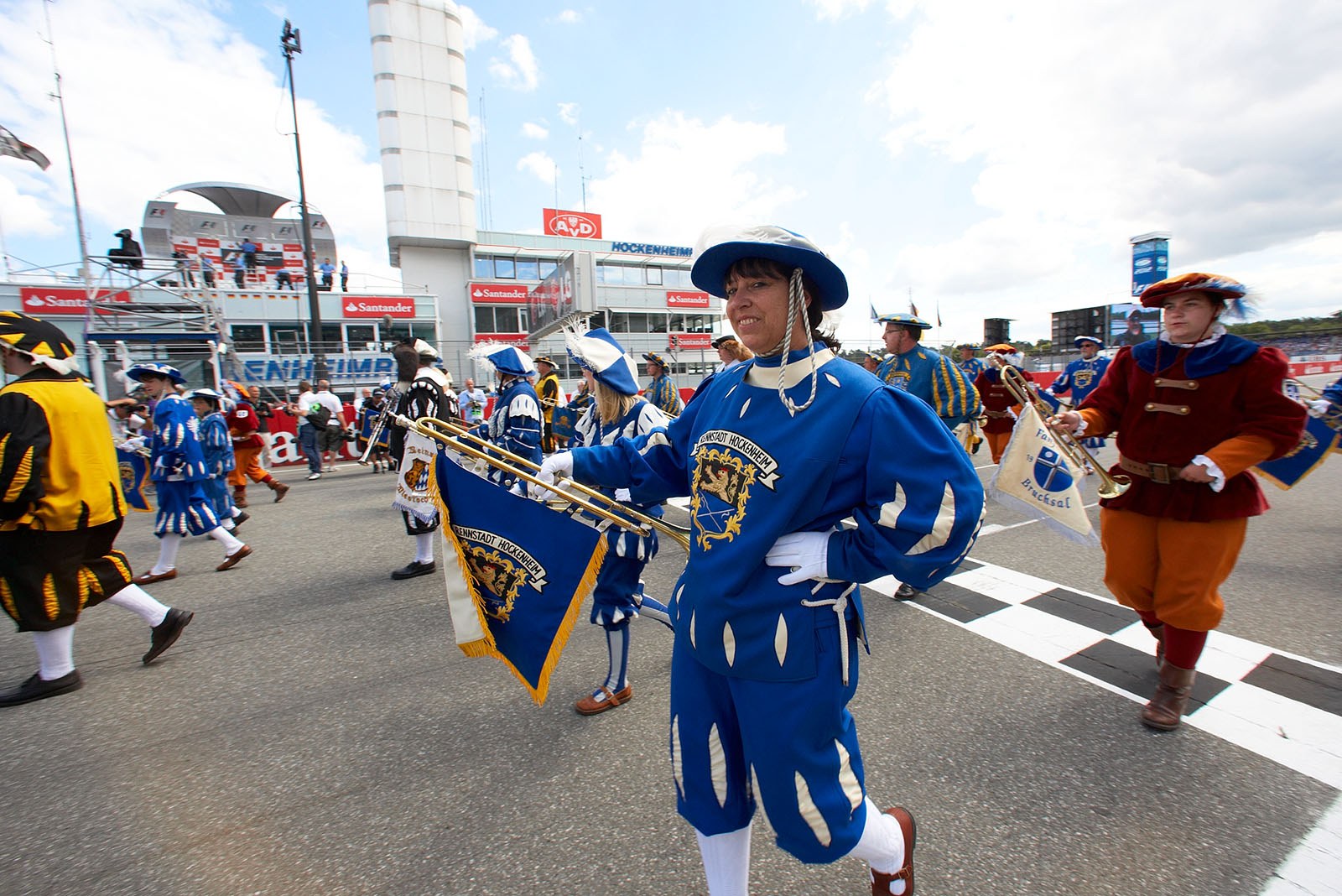 A marching band takes care of the entertainment on the grid before the race cars appear