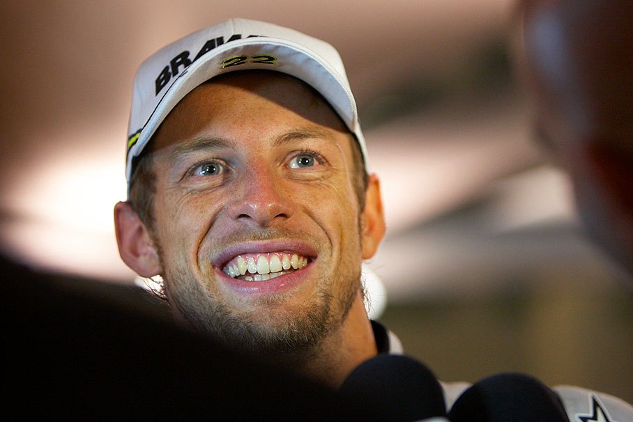 The happy Formula One World Champion Jenson Button after 2009 season's last race