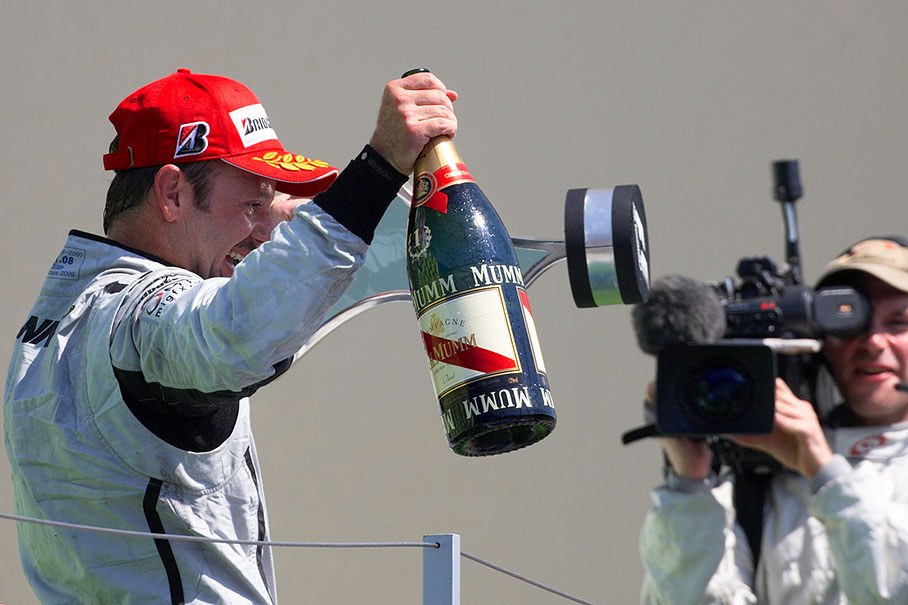 Rubens Barrichello shows his trophies to the worldwide audience
