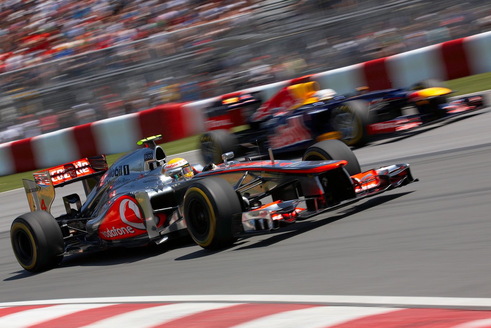 Lewis Hamilton, McLaren Mercedes, overtakes Sebastian Vettel