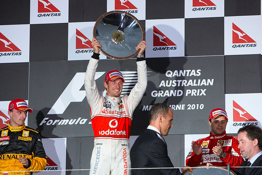 Race winner and 2009 World Champion Jenson Button presents his trophy