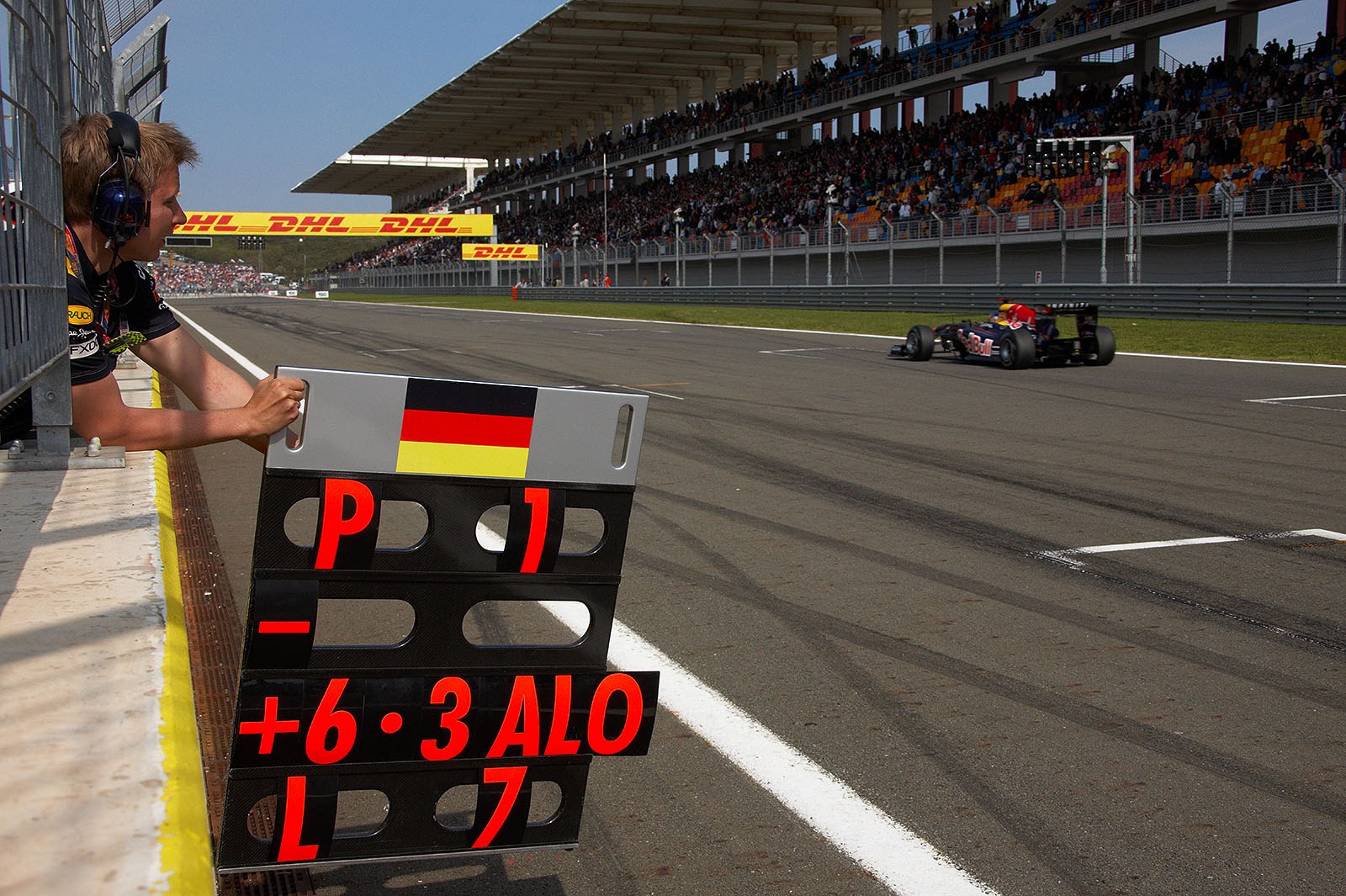 Tommi Parmakoski signals first place and seven laps to go for Sebastian Vettel