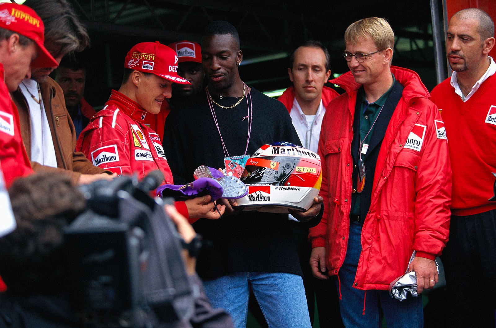 Ferrari driver Michael Schumacher with American sprinter Michael Johnson
